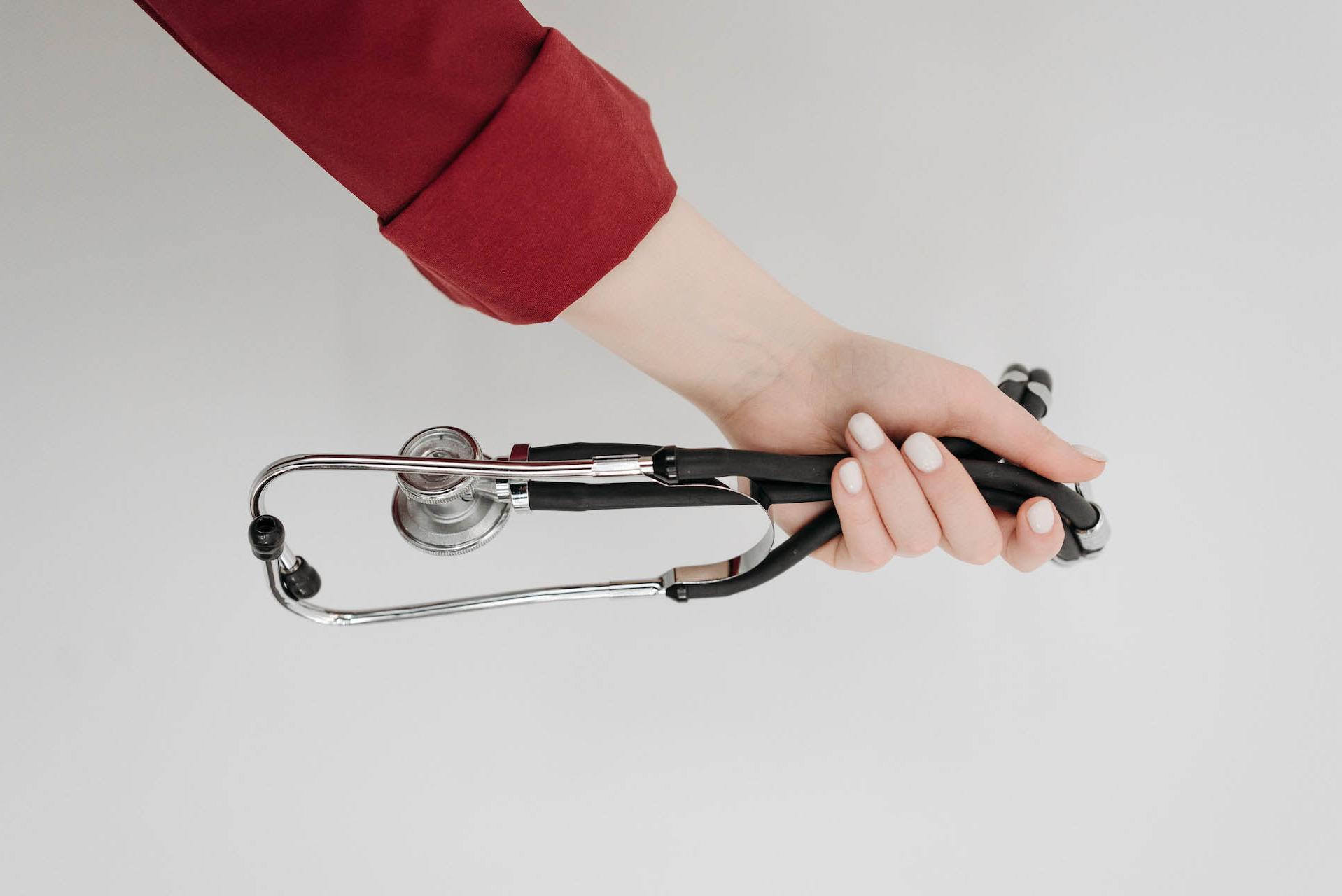 Woman holding a stethoscope