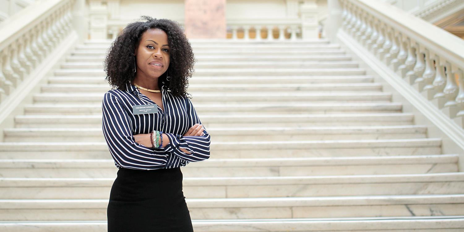 student on steps of government building