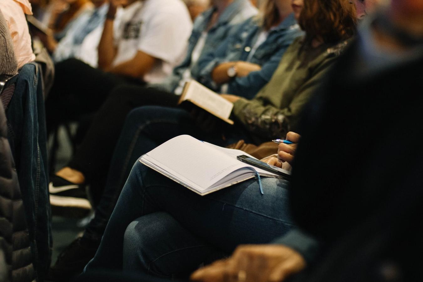 People sitting listening to a presentation