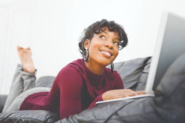 Student with laptop on a couch